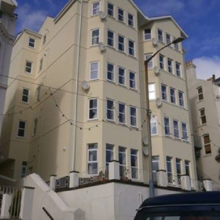 The finished apartment block seen from the bottom of the steps