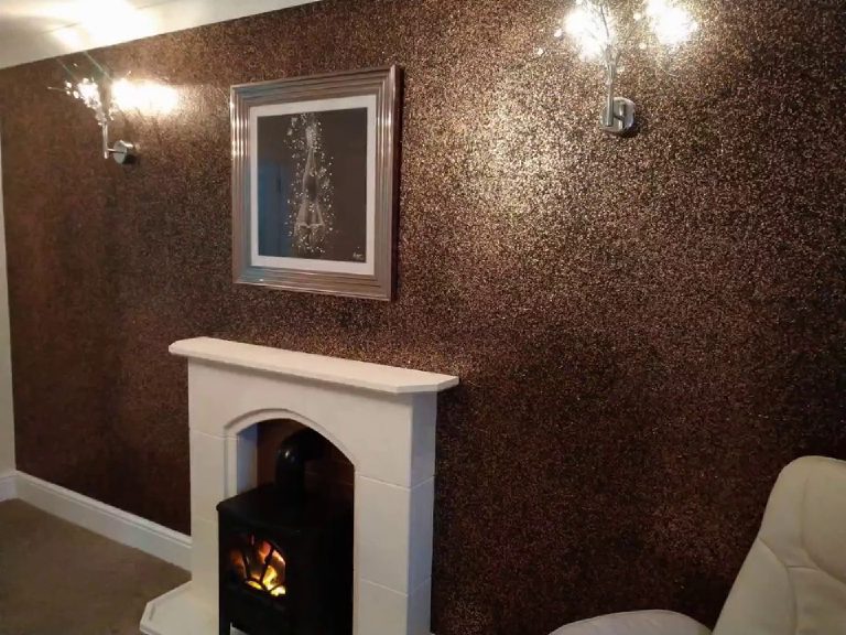 The stone fireplace and lit stove set against the dark sparkle