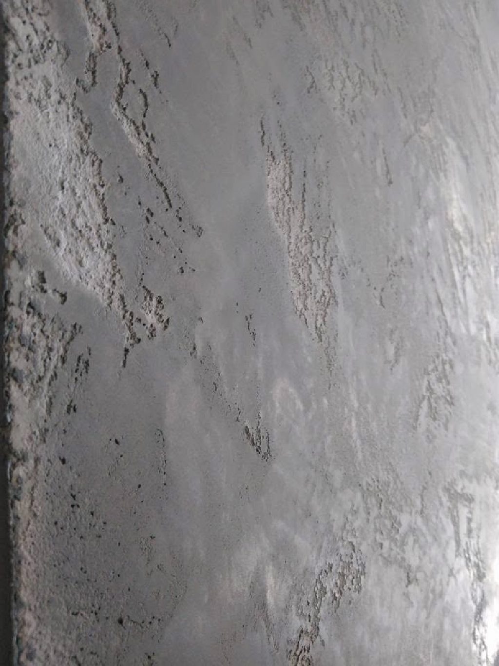 Detail of the weathered concrete texture with a soft sheen