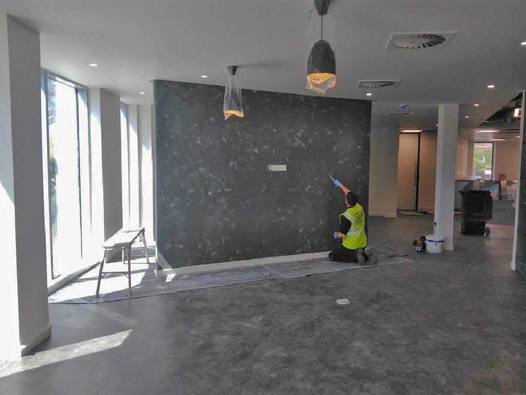The feature wall taking shape in the open-plan office