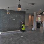 The feature wall taking shape in the open-plan office
