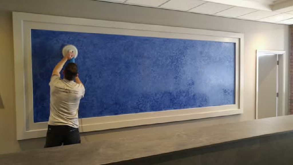 The panel taking its final polish behind the new desk