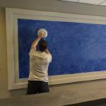 The panel taking its final polish behind the new desk