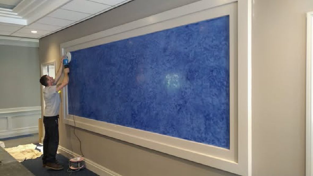 The framed blue feature panel above the reception desk