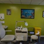 The lime green Ilumitextra wall behind the treatment chair