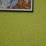 Silver flake sparkling in the lime green wall