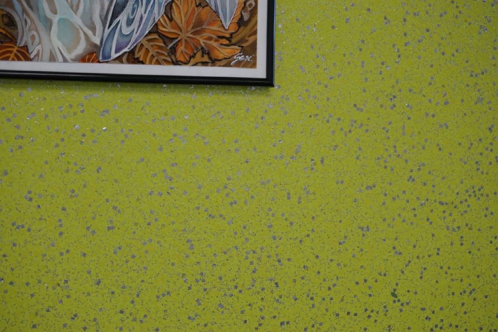Silver flake sparkling in the lime green wall