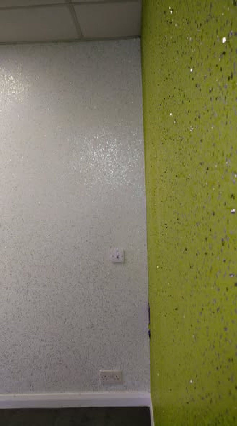 Where the white sparkle wall meets the green