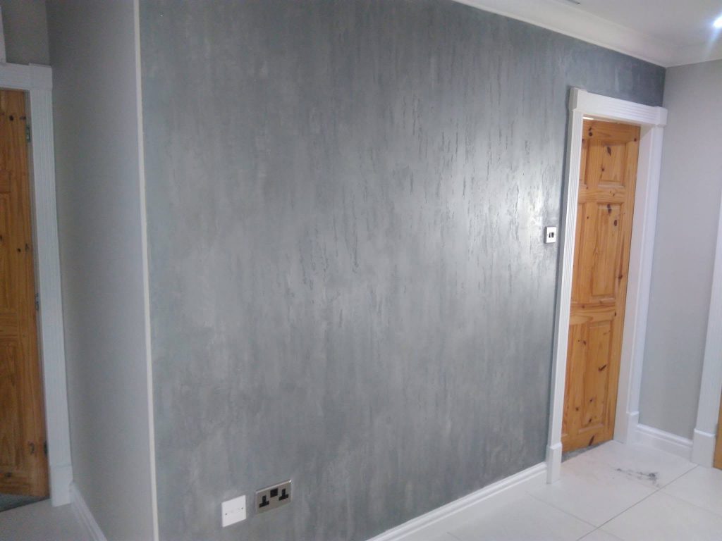 The silver Marmorino wall running the hall, pine doors either end