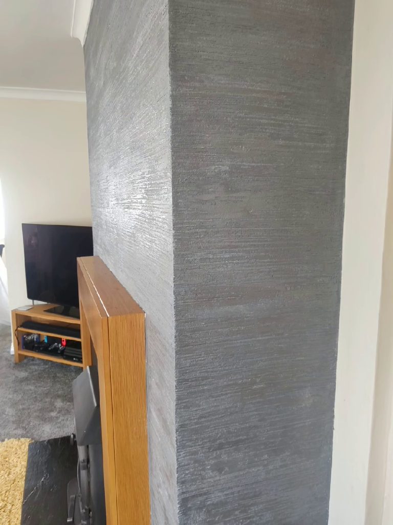 The plastered return of the fire breast running from floor to ceiling