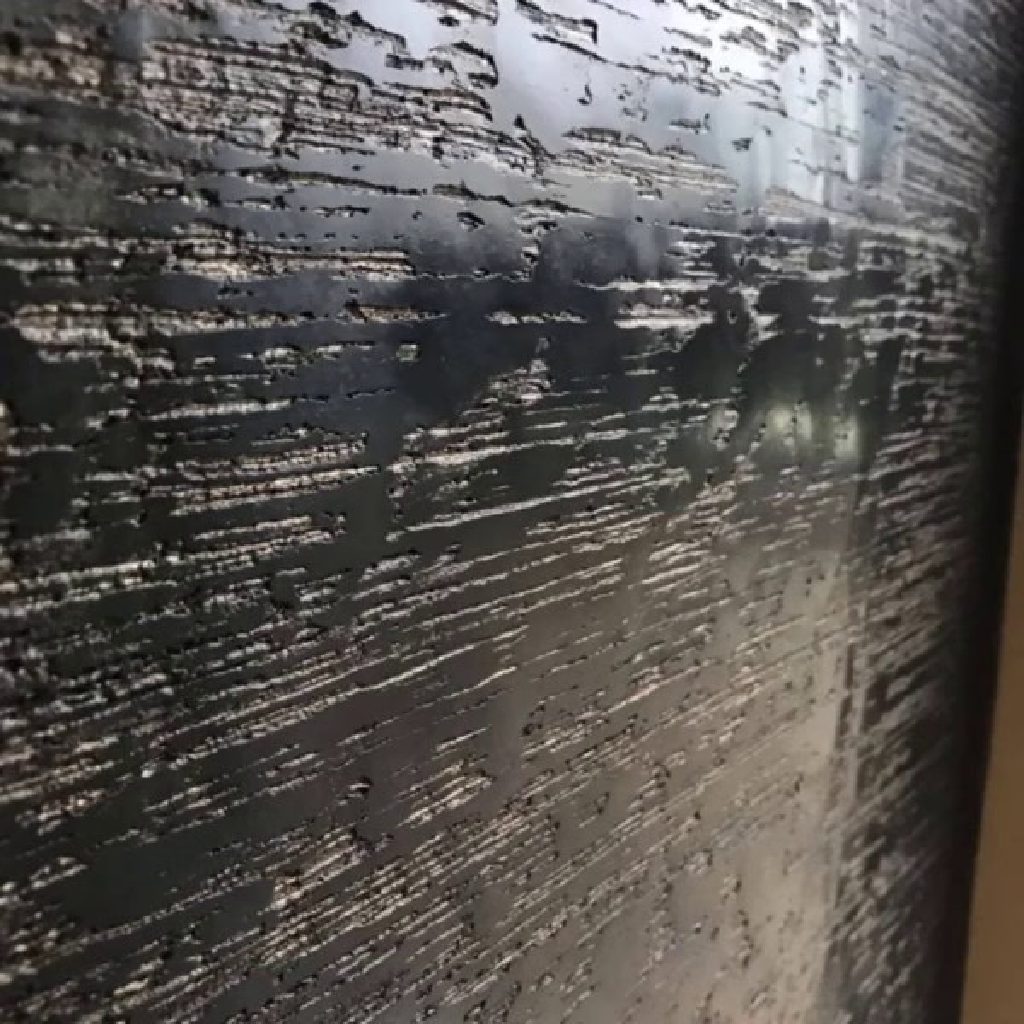 The streaked black and bronze texture up close