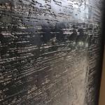 The streaked black and bronze texture up close