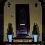 The porch after dark with the lanterns lit and the gold flake sparkling across the walls