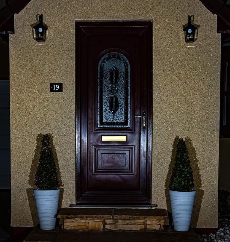 The door and the Crystal Quartz walls at night, the leaded glass lit from within