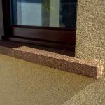 The window sill picked out in darker bronze Crystal Quartz against the sand-coloured wall