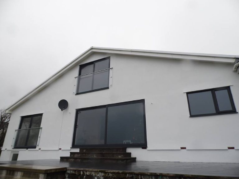 The finished elevation with glass balcony