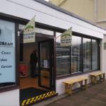 The finished shopfront with flags flying and benches out