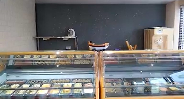 The feature wall behind the ice cream display cabinets