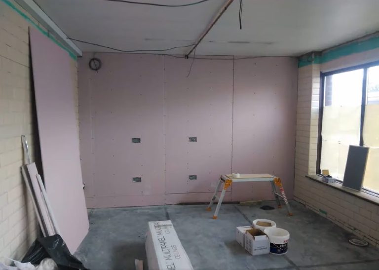 The new partition wall boarded out inside the shop