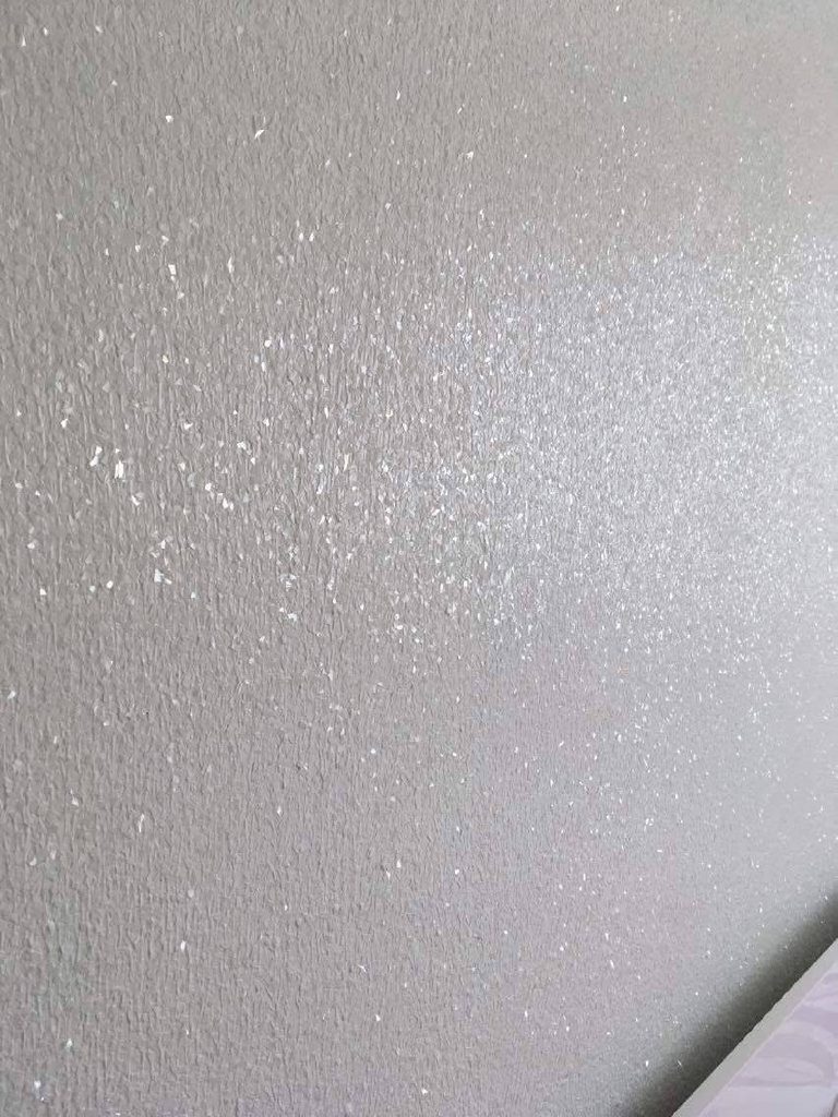 Close-up of the white glitter suspended in the finish