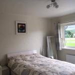 The bedroom transformed by the glitter feature wall