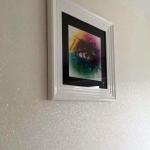 The rainbow eye picture on the sparkling white wall