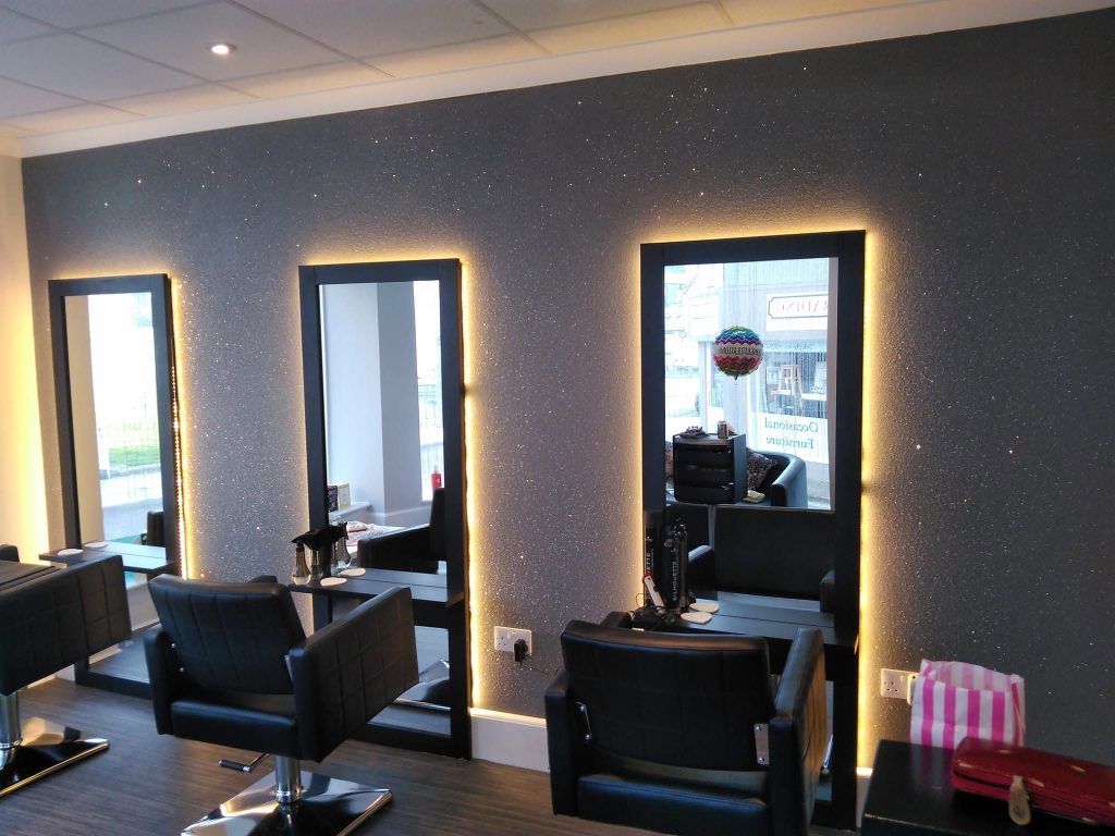 The salon's glitter wall catching the light down its full length