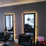 The salon's glitter wall catching the light down its full length