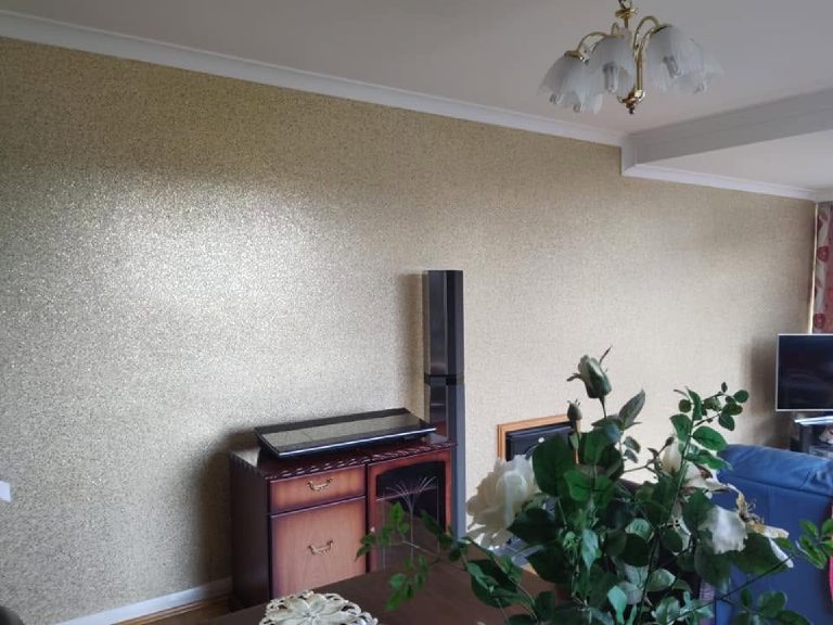 The finished wall square on, fireplace and sideboard back in place