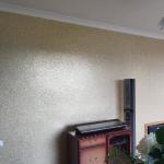 The finished glitter wall behind the fireplace and sideboard