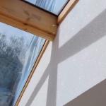 The vaulted glazed roof on oak beams, glitter wall running up to it