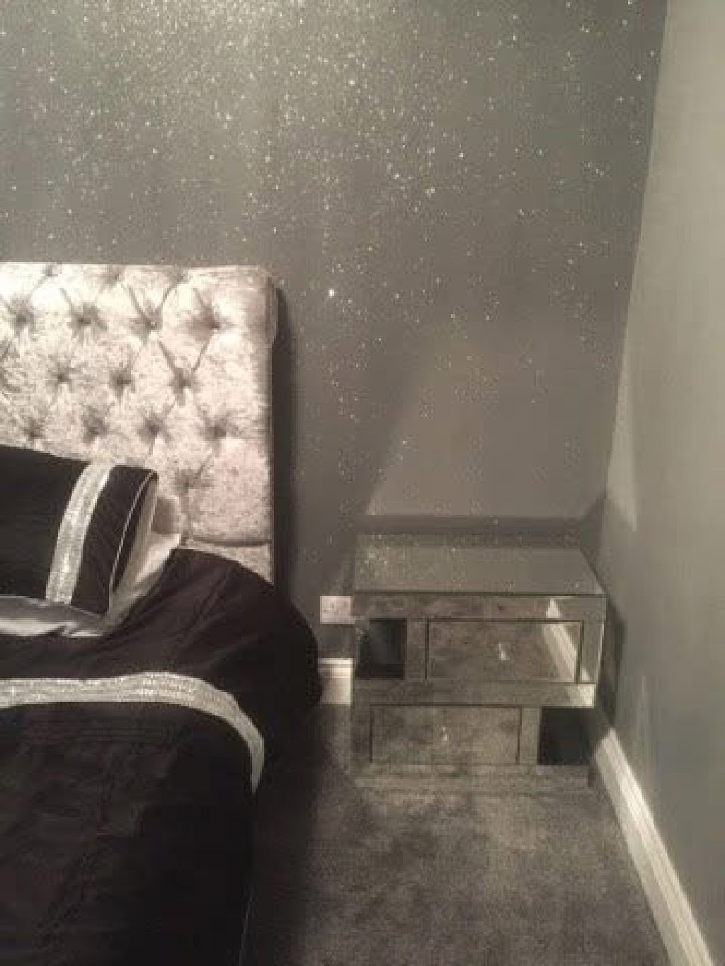 The glitter wall meeting the mirrored bedside table