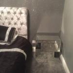 The glitter wall meeting the mirrored bedside table
