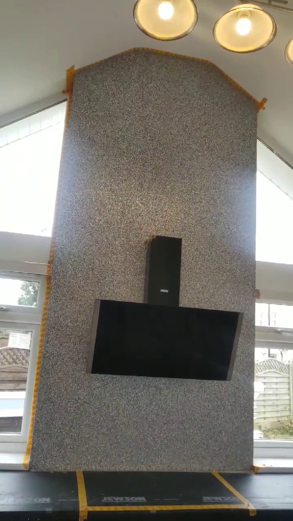 The extractor hood set against the grey glitter finish
