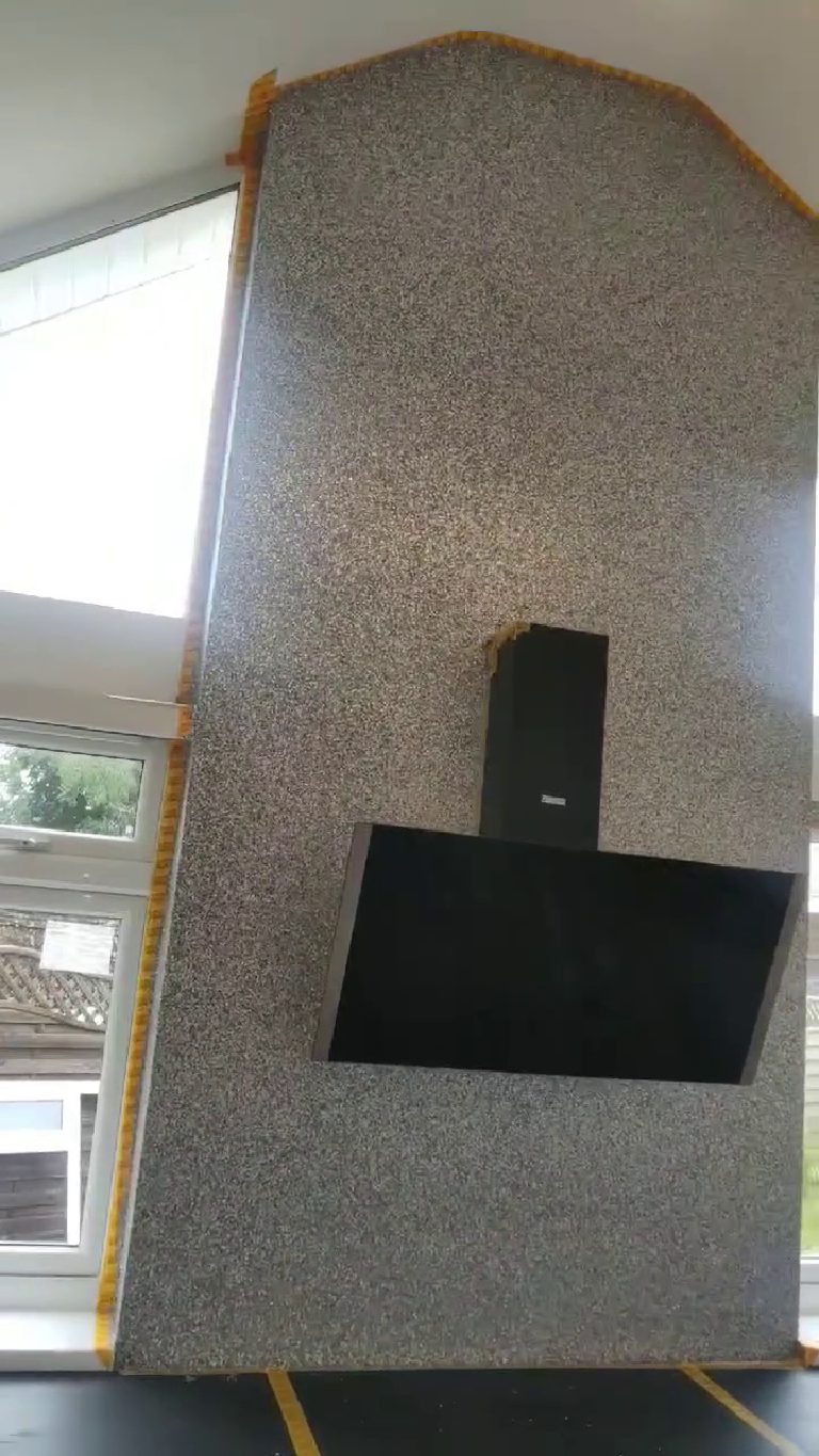 The feature wall seen at an angle, showing the depth of the chimney breast
