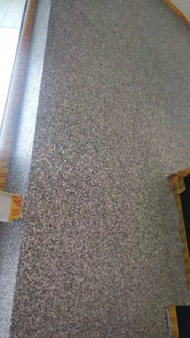 Masking tape along the edge of the wall and around the extractor