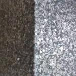 The corner of the wall with daylight raking across the glitter