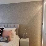 The bedroom with its grey and silver glitter walls