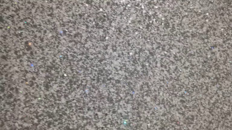 The holographic flecks scattered through the grey and silver glitter