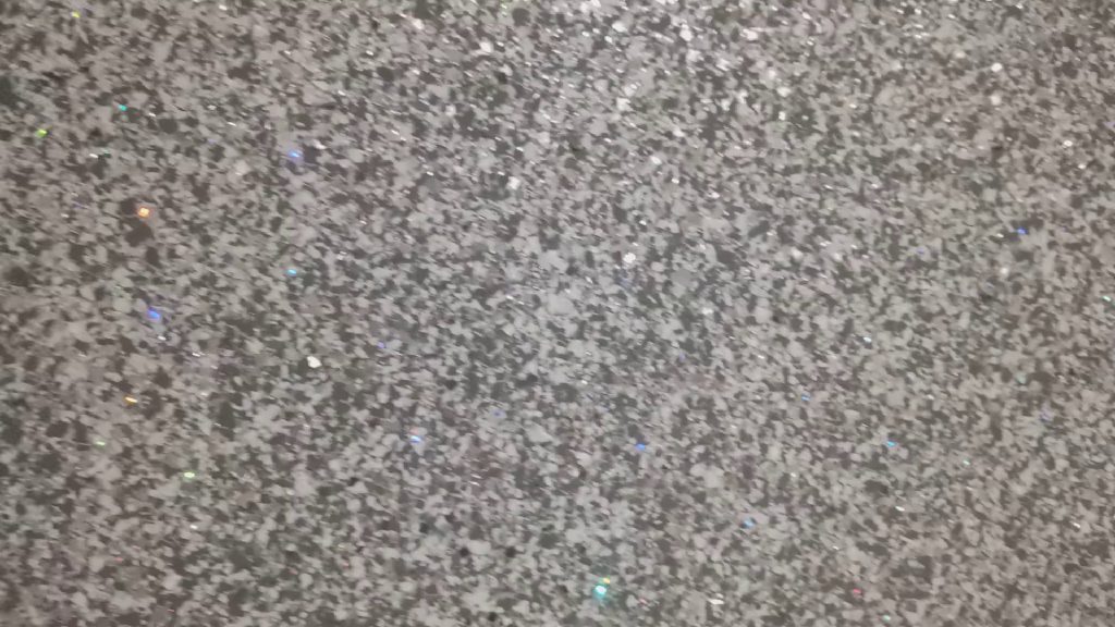 The grey and silver glitter with holographic flecks, up close