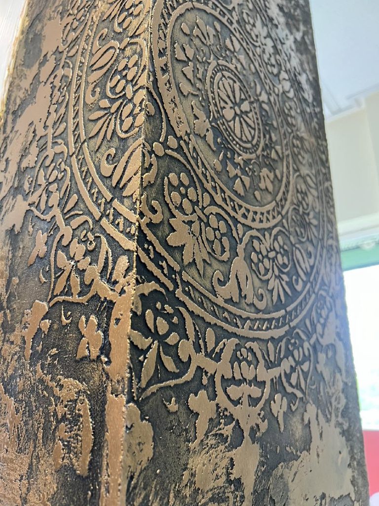 The bronze stencil close up, the pattern carried around the corner of the pier