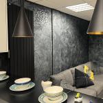 Black Marmorino with silver wax wrapping the showroom living area, stencilled medallions on two walls