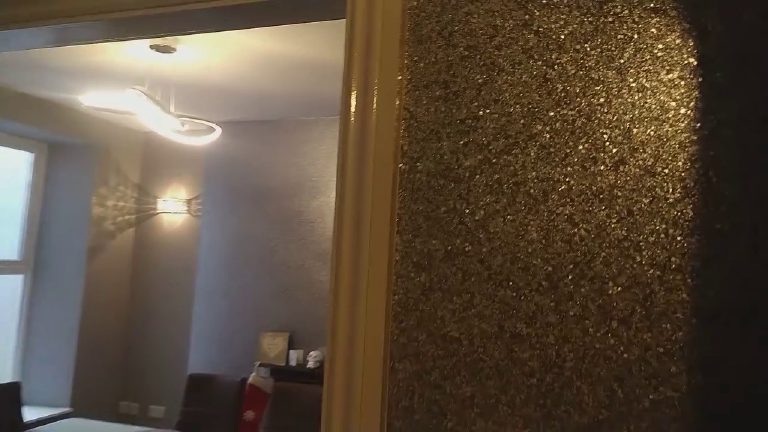 A fire breast in pure metallic glitter beside the doorway