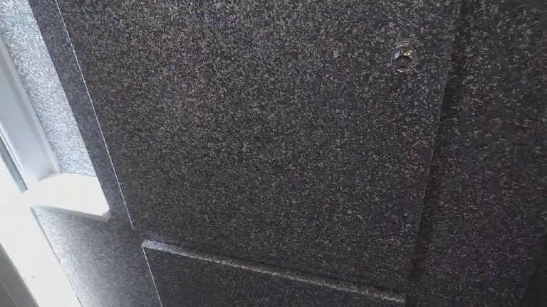 A cupboard door finished in the same glitter as the walls around it