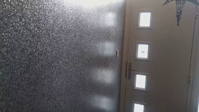 The glitter wall catching the light beside the front door