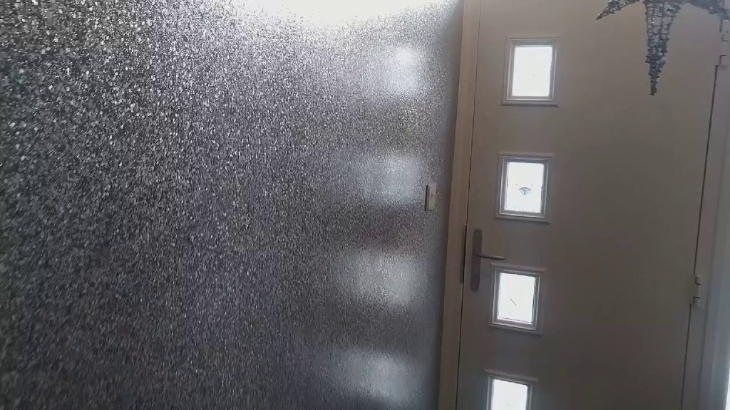The sparkling wall beside the front door