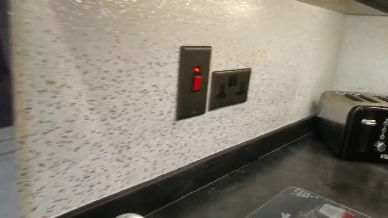 The Ilumitextra finish close up behind the worktop, sockets set into it