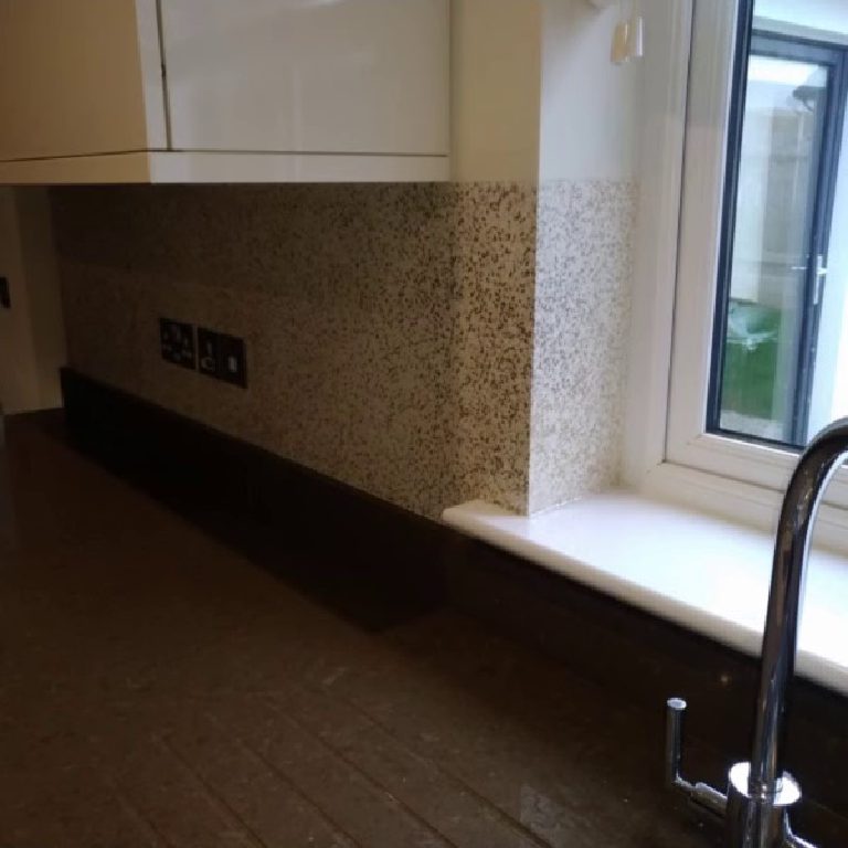 The splashback carried along the wall under the window