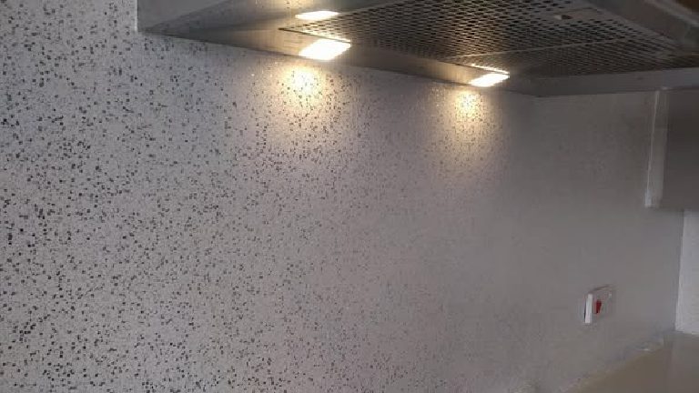 The flake glittering under the extractor lights