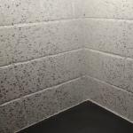 The white and silver glitter coating the tiled corner